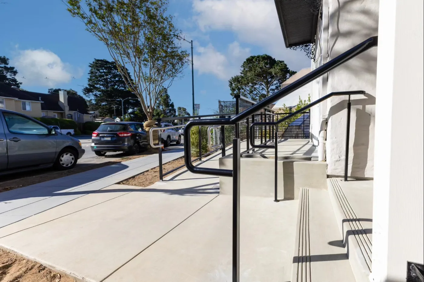The finished ramp, entry steps, and new sidewalk running to the street — ADA Ramp & Sidewalk — West Portal, West Portal, San Francisco