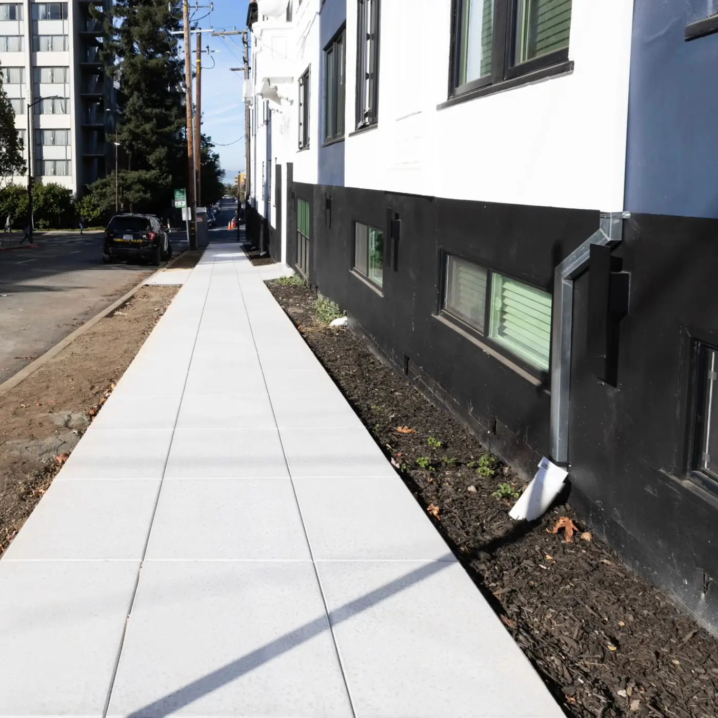 Fresh public sidewalk along multi-unit building — Durant Sidewalk — UC Berkeley, Berkeley, CA