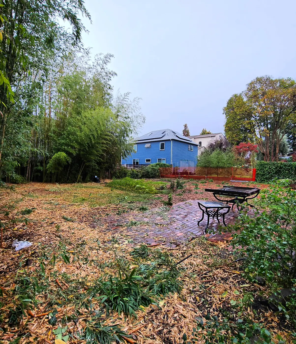 Cleared lot, blue ADU behind — ADU Foundations — Two Projects, SF Bay Area