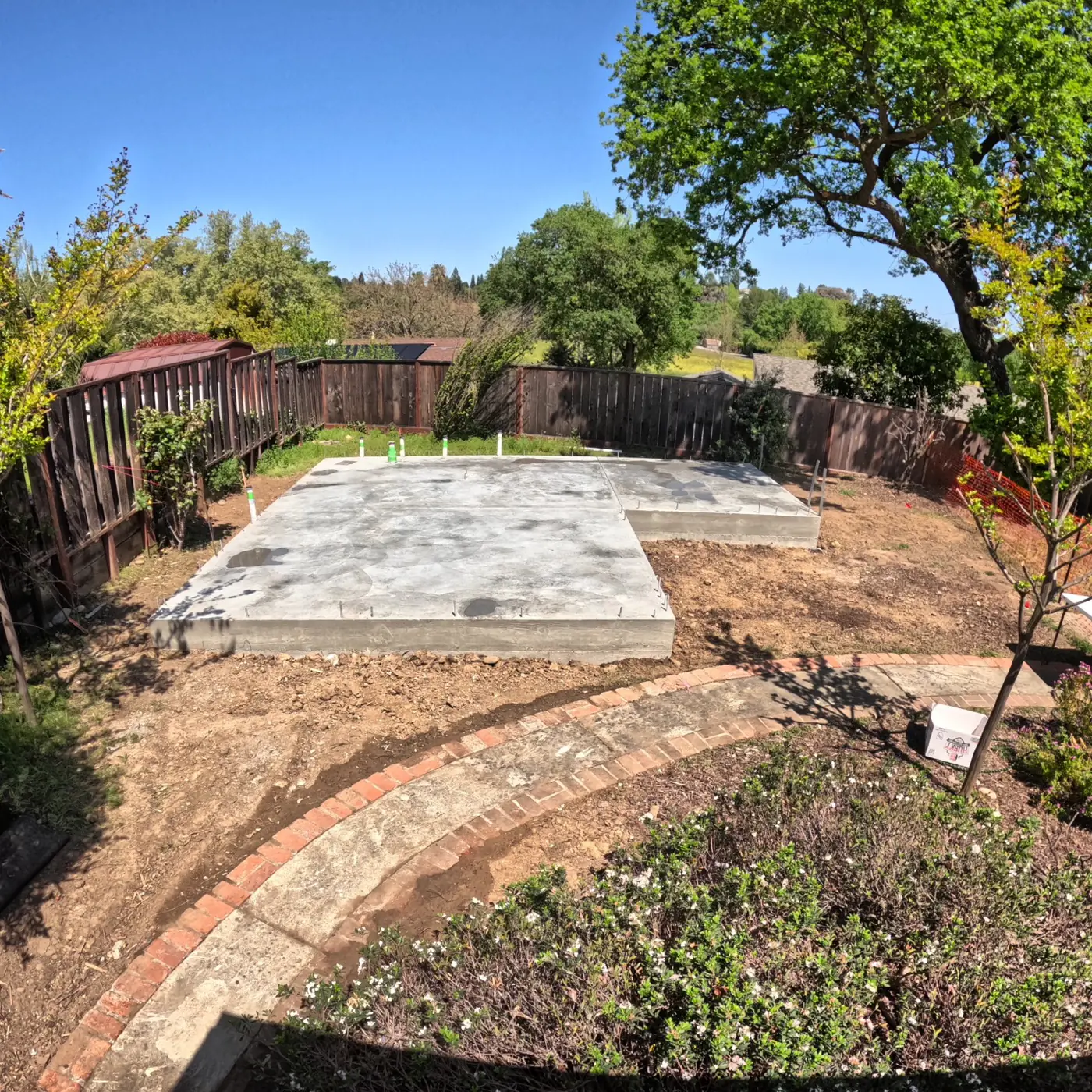 Aerial of the completed raised slab curing in the backyard — Pleasant Hill ADU Foundation, Pleasant Hill, CA