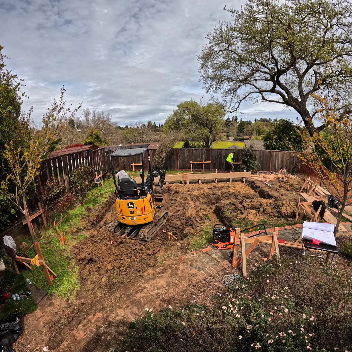 Aerial excavation w/ excavator + workers — Pleasant Hill ADU Foundation, Pleasant Hill, CA