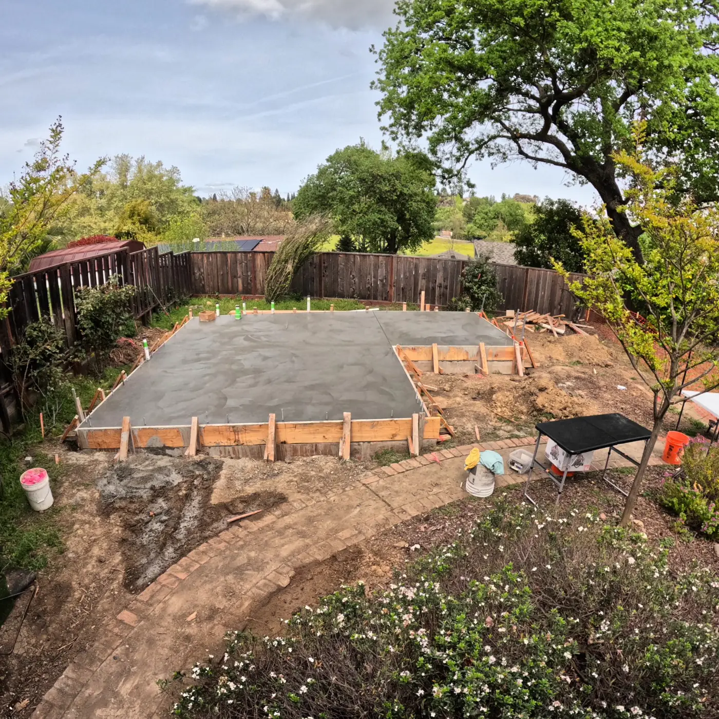 Aerial poured slab in forms, wet — Pleasant Hill ADU Foundation, Pleasant Hill, CA