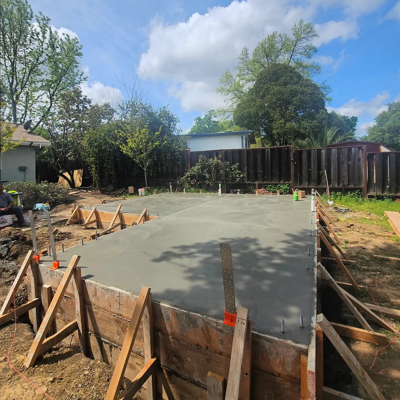 Ground-level poured slab in forms, wet — Pleasant Hill ADU Foundation, Pleasant Hill, CA