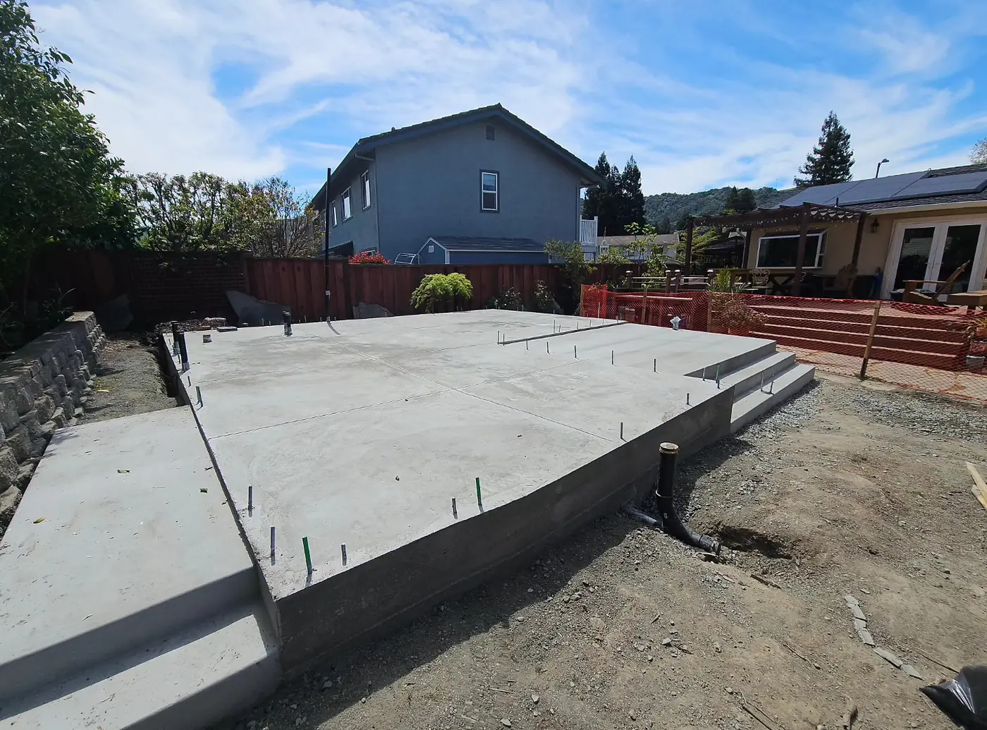 Finished ADU slab opposite corner, pergola behind — Pleasanton ADU Foundation, Pleasanton, CA