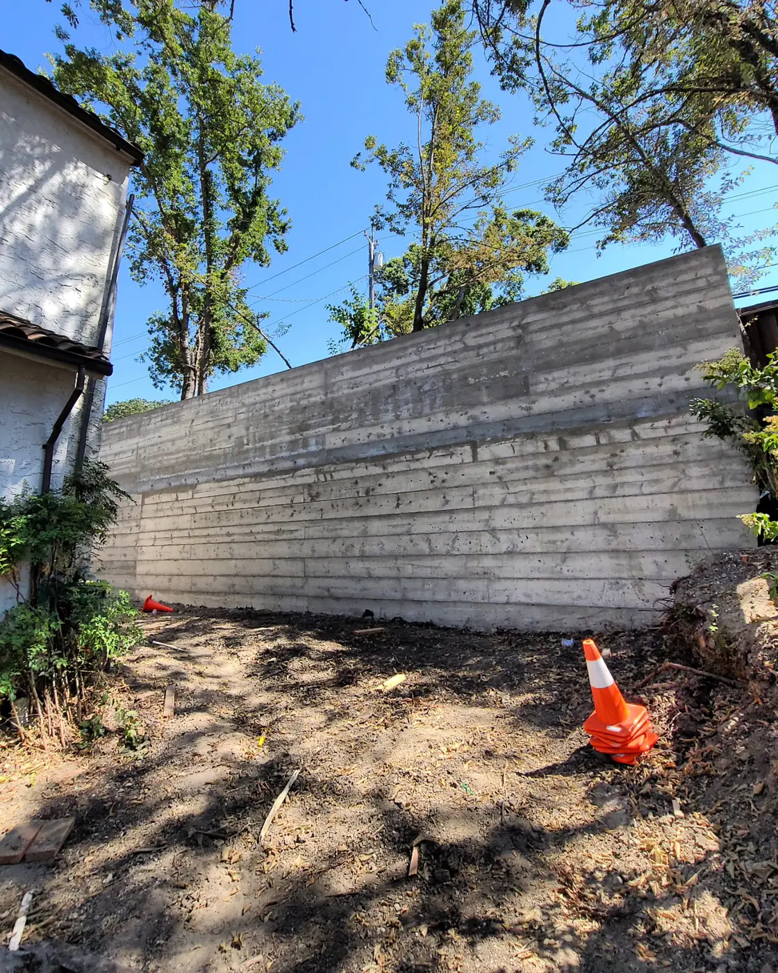 Completed board-formed wall, traffic cone, house left — Sound Wall Replacement — Diablo Country Club, Danville, CA