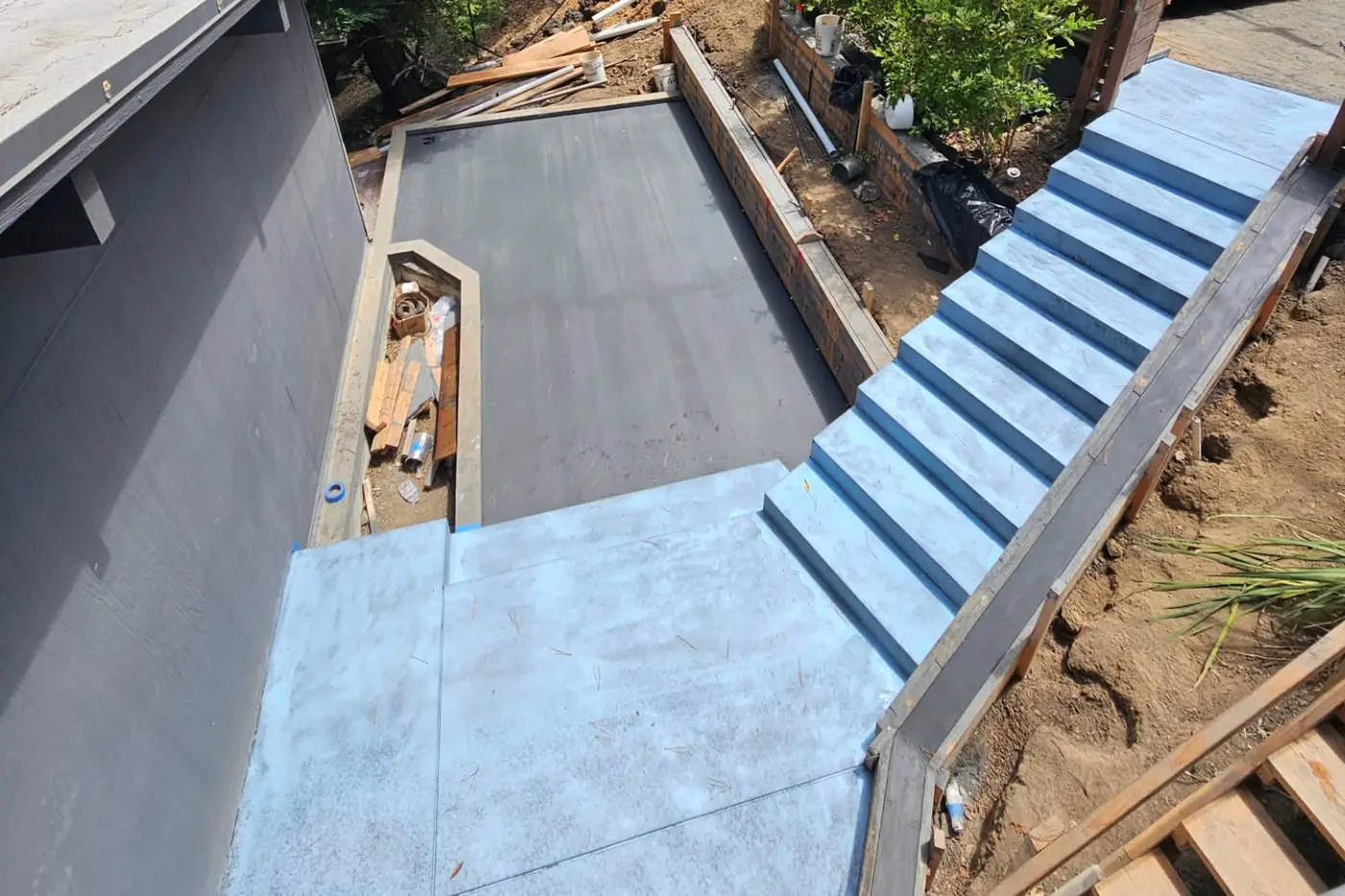 Aerial poured stairs/patio mid-construction — Hillside Outdoor Living Transformation, Oakland, CA