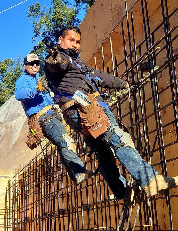 New Edge Concrete founders Jose Rosales and Roberto Santana on a rebar-reinforced concrete wall