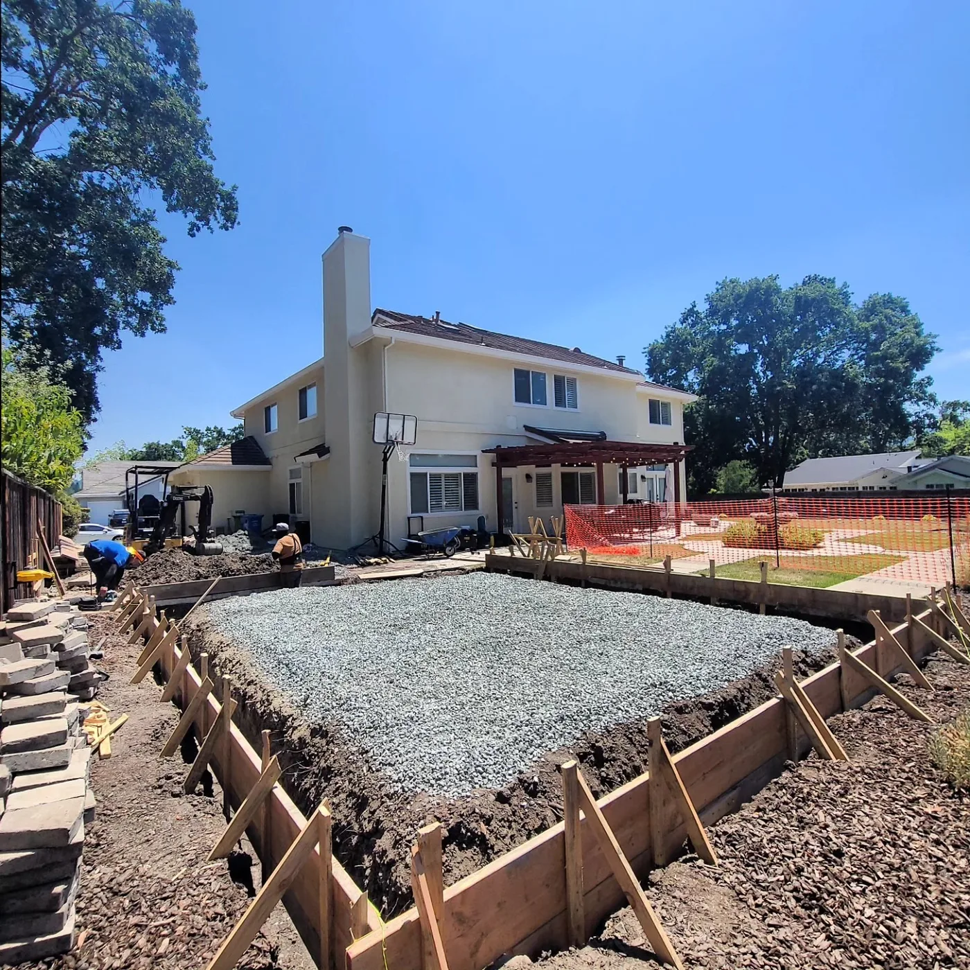 Compacted gravel base spread in the formed ADU footprint — Alamo ADU Foundation, Alamo, CA