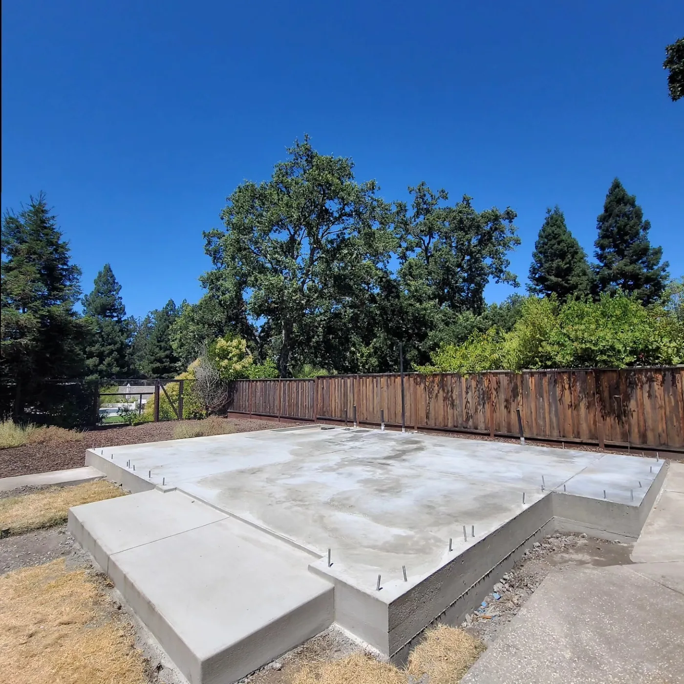 The completed raised slab foundation with anchor bolts and thickened edge, forms removed — Alamo ADU Foundation, Alamo, CA