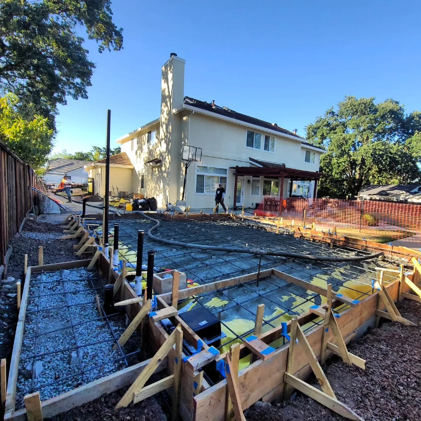 Rebar mat and rigid insulation set in the forms with plumbing stubs before the pour — Alamo ADU Foundation, Alamo, CA