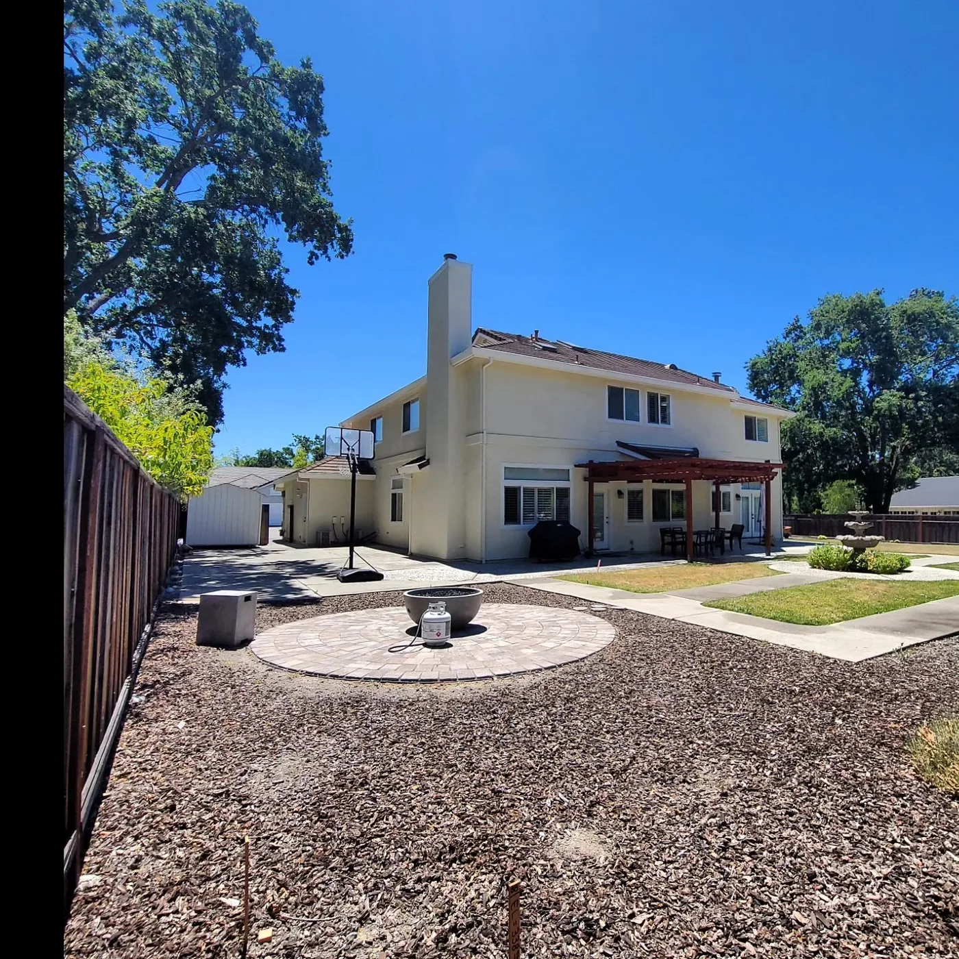 The backyard where the ADU will sit, main house and existing patio behind — Alamo ADU Foundation, Alamo, CA