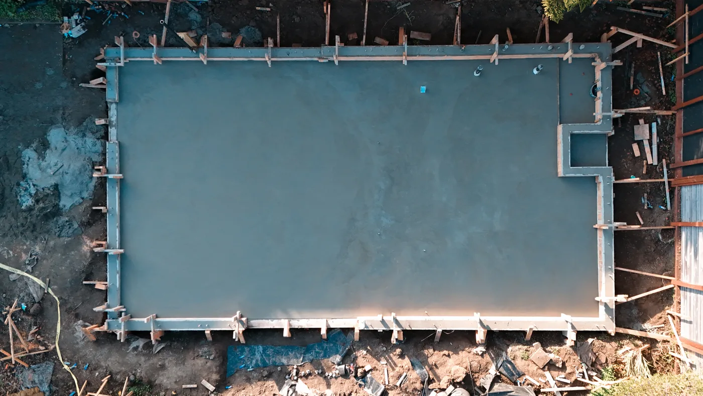 A framing-ready ADU slab with anchor bolts set, still in its forms — Berkeley, CA