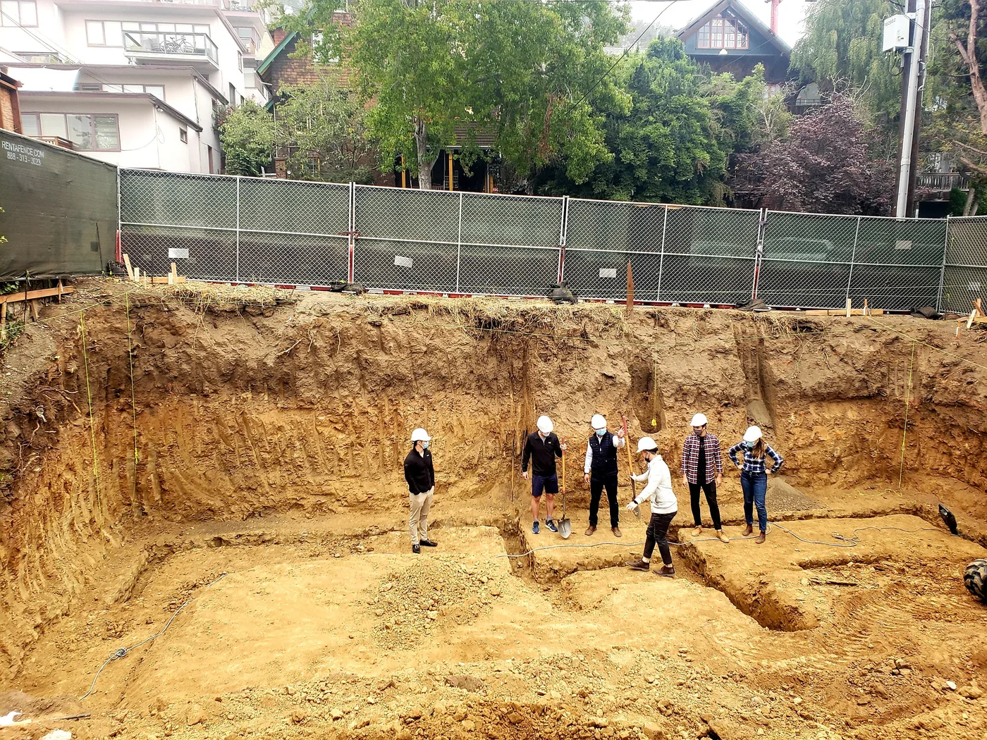 The crew in the deep basement excavation pit, benched soil walls — Berkeley Student Housing Foundation, Berkeley, CA
