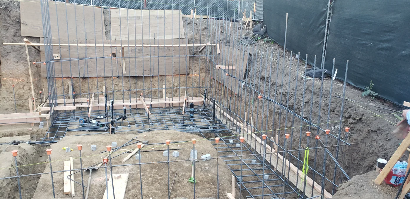 Reinforcing-steel cages for the basement walls with shoring — Berkeley Student Housing Foundation, Berkeley, CA