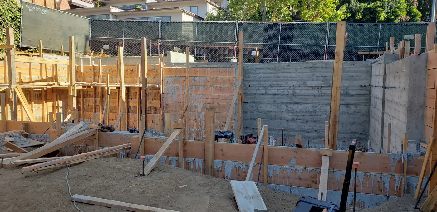 Formed basement walls with rebar, shoring behind — Berkeley Student Housing Foundation, Berkeley, CA