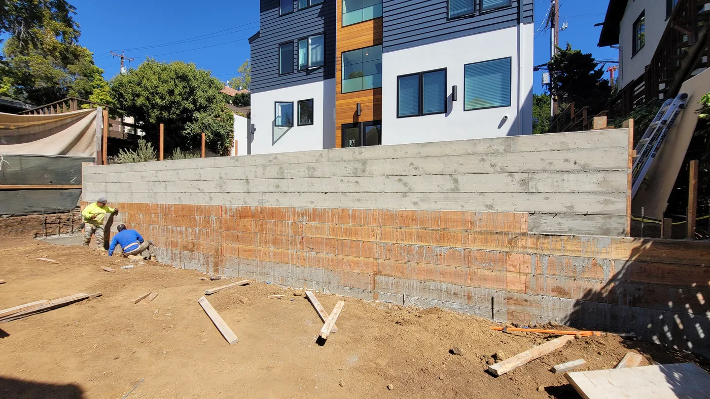 Board-formed retaining wall poured, building behind — Berkeley Student Housing Foundation, Berkeley, CA
