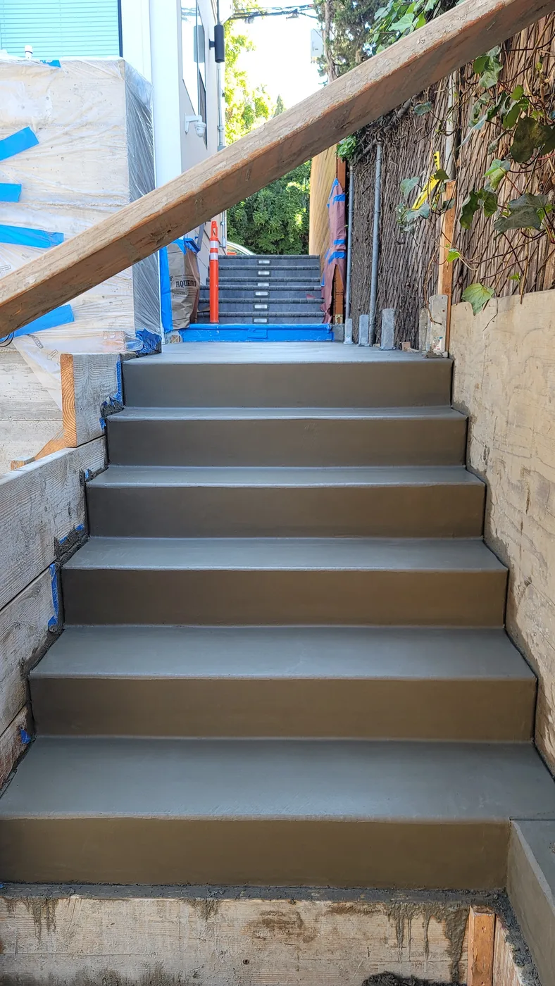 Finished cast-in-place concrete stairway with handrail — Berkeley Student Housing Foundation, Berkeley, CA