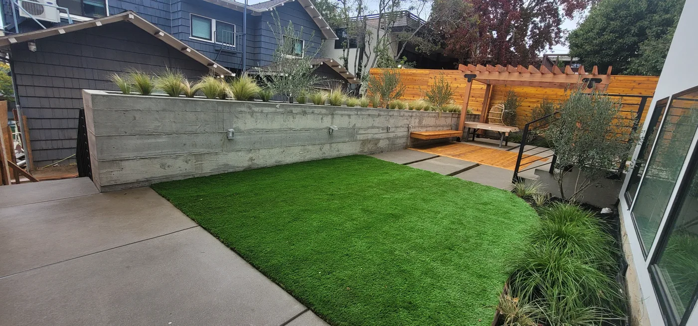 Finished backyard — retaining wall, turf lawn, and walkway — Berkeley Student Housing Foundation, Berkeley, CA