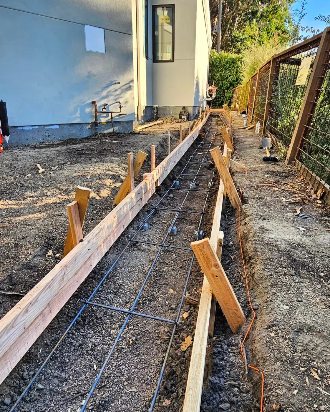 Forms and wire mesh set in the trench line before the pour — Danville Landing Pad & Curb Drainage, Danville, CA
