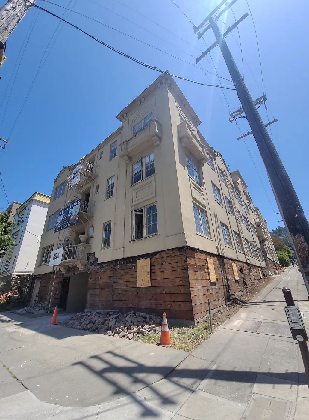 The four-story building at College and Durant, ground level shored and boarded before excavation — Durant Basement Foundation, Berkeley, CA