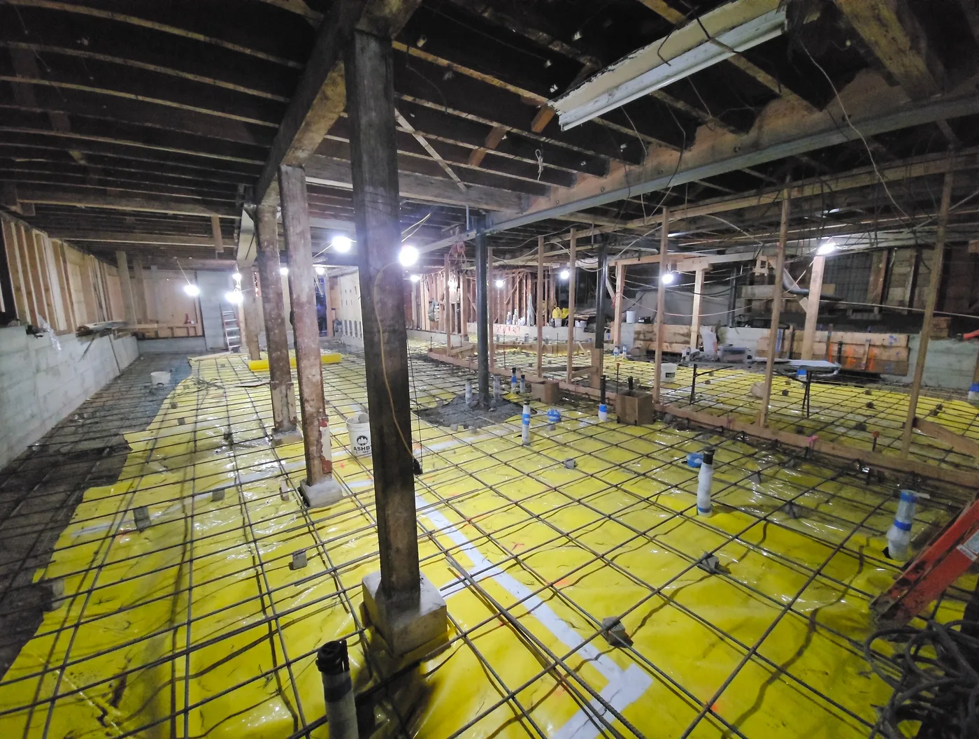 Slab prep complete — vapor barrier, rebar grid, and plumbing stubs throughout — Durant Basement Foundation, Berkeley, CA