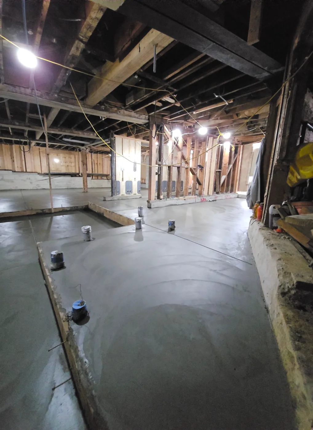 The finished basement slab with plumbing stub-ups, ready for framing — Durant Basement Foundation, Berkeley, CA