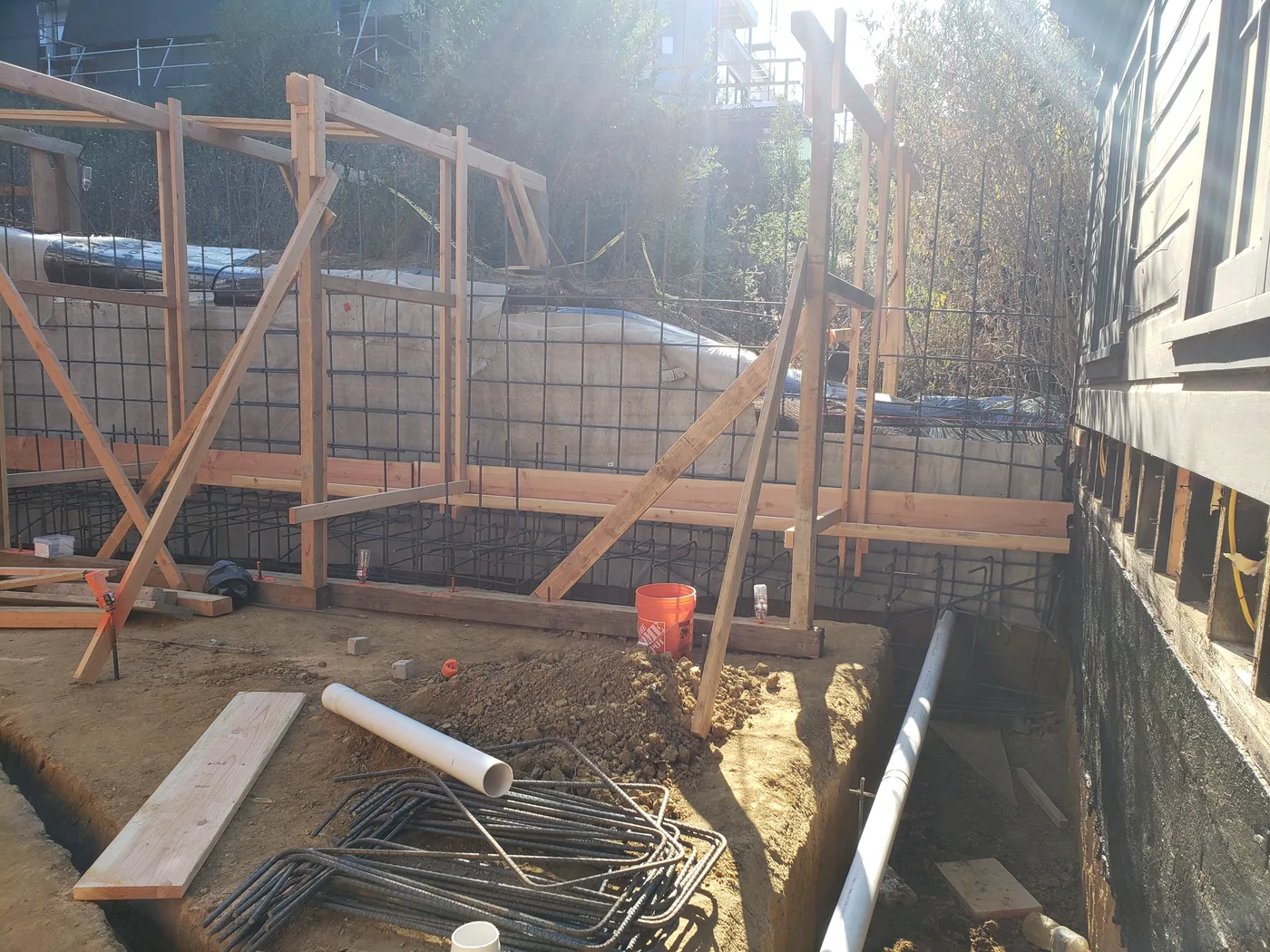 Braced retaining-wall forms with rebar dowels before the pour — Lombard Street Basketball Court Foundation, San Francisco, CA