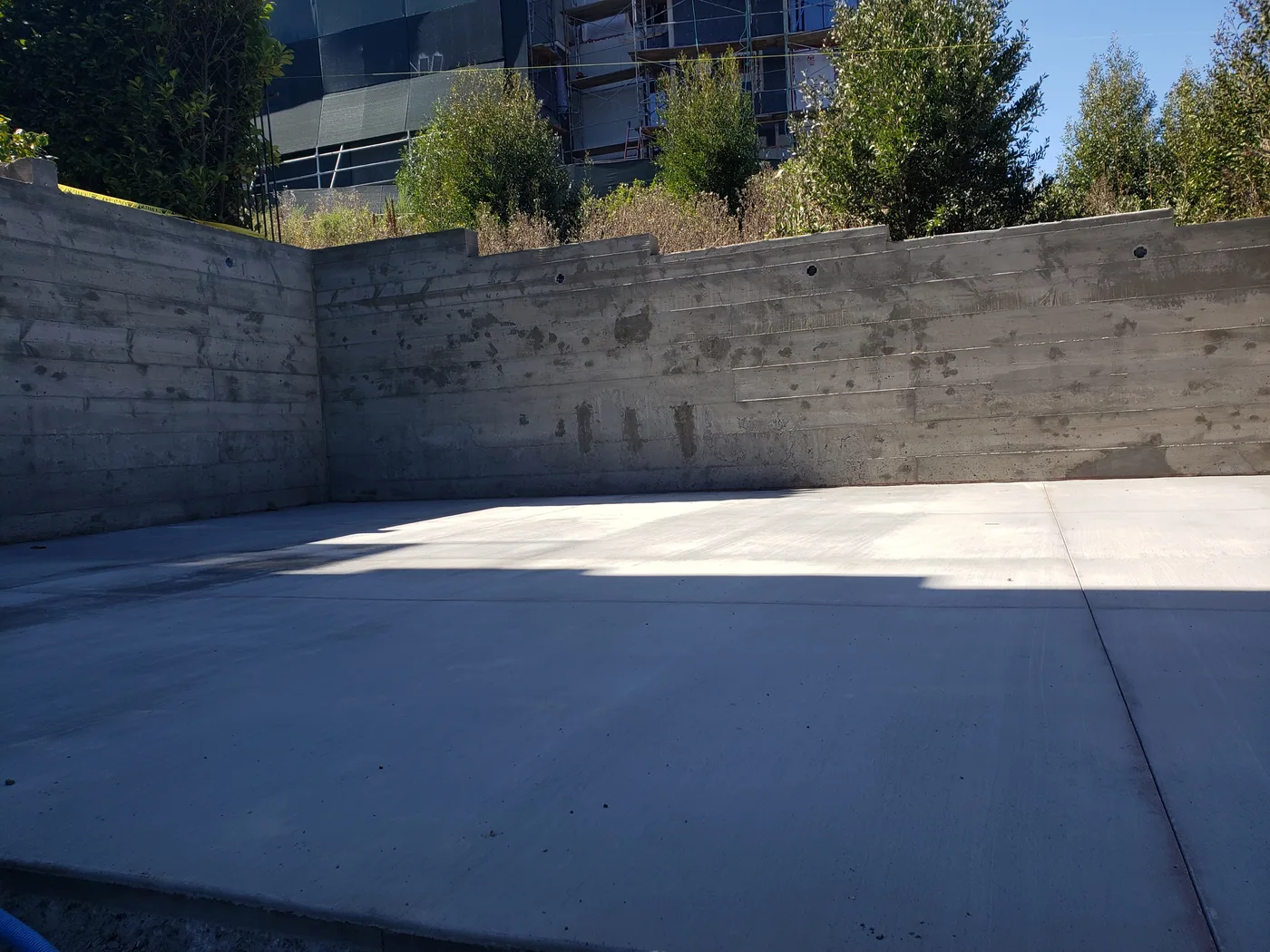 Completed concrete court slab and retaining walls — Lombard Street Basketball Court Foundation, San Francisco, CA