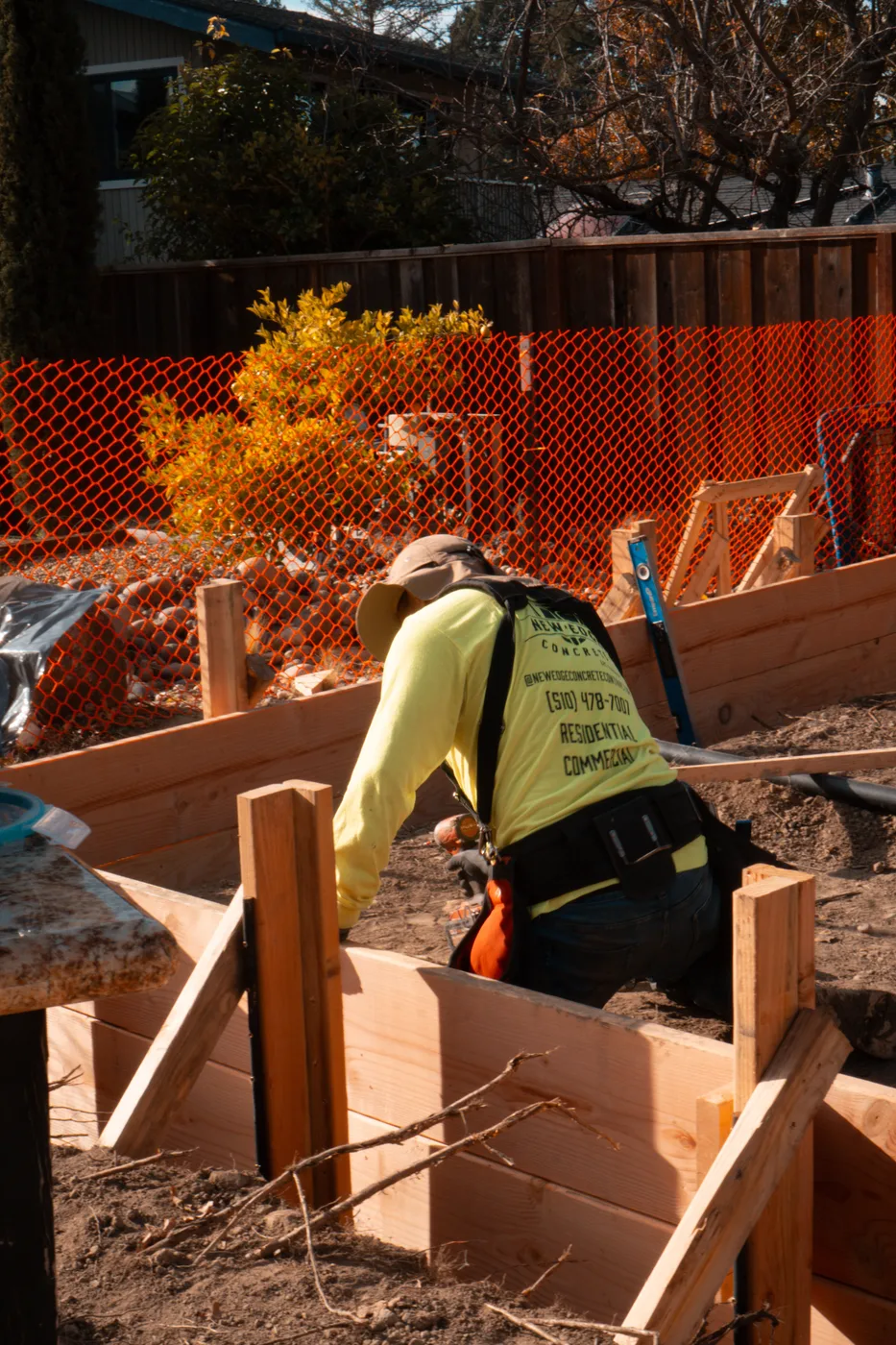 New Edge crew member setting form boards along the ADU footprint — Moraga Backyard ADU, Moraga, CA