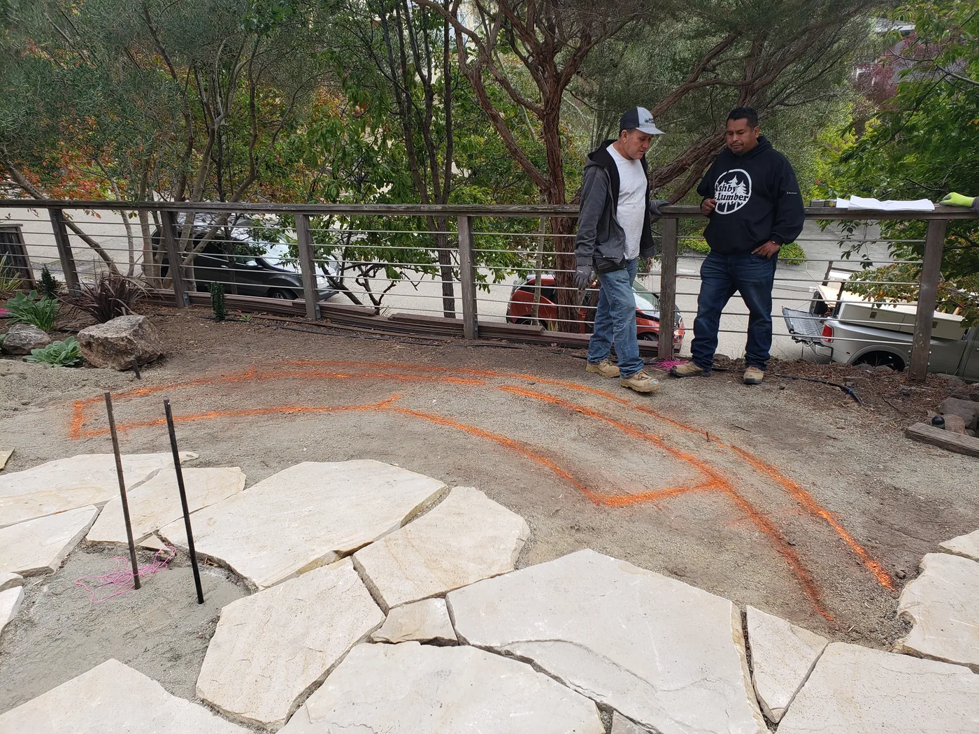 Laying out the curved bench footprint in chalk on the flagstone patio — Piedmont Custom Concrete Bench, Piedmont, CA