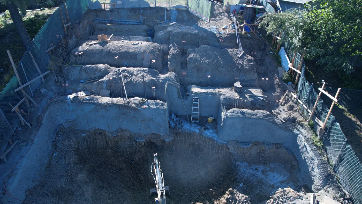 Aerial of the excavated foundation footprint with shoring — Oakland Hills Custom Home, Oakland, CA