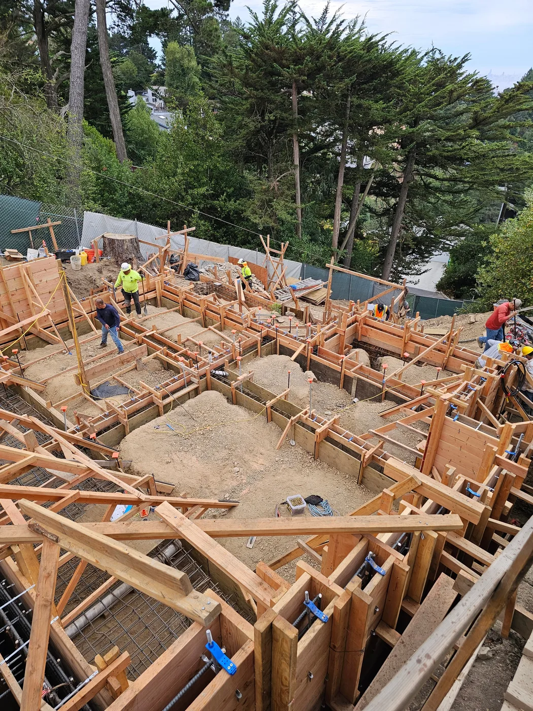 Aerial of extensive wood formwork across the foundation — Oakland Hills Custom Home, Oakland, CA