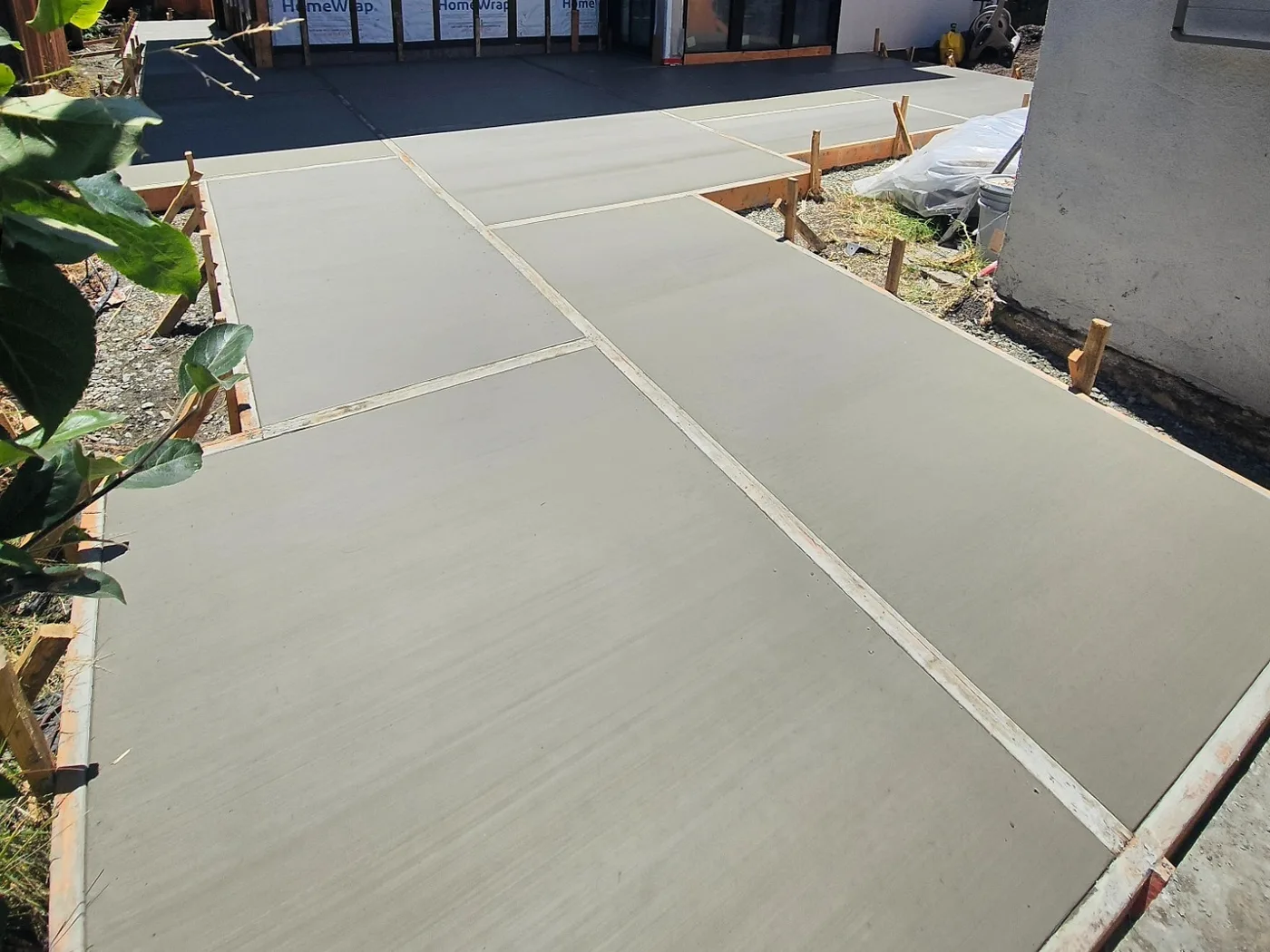 Finished-troweled panels curing in the sun before the joints are cleaned out — Richmond Outdoor Patio, Richmond, CA