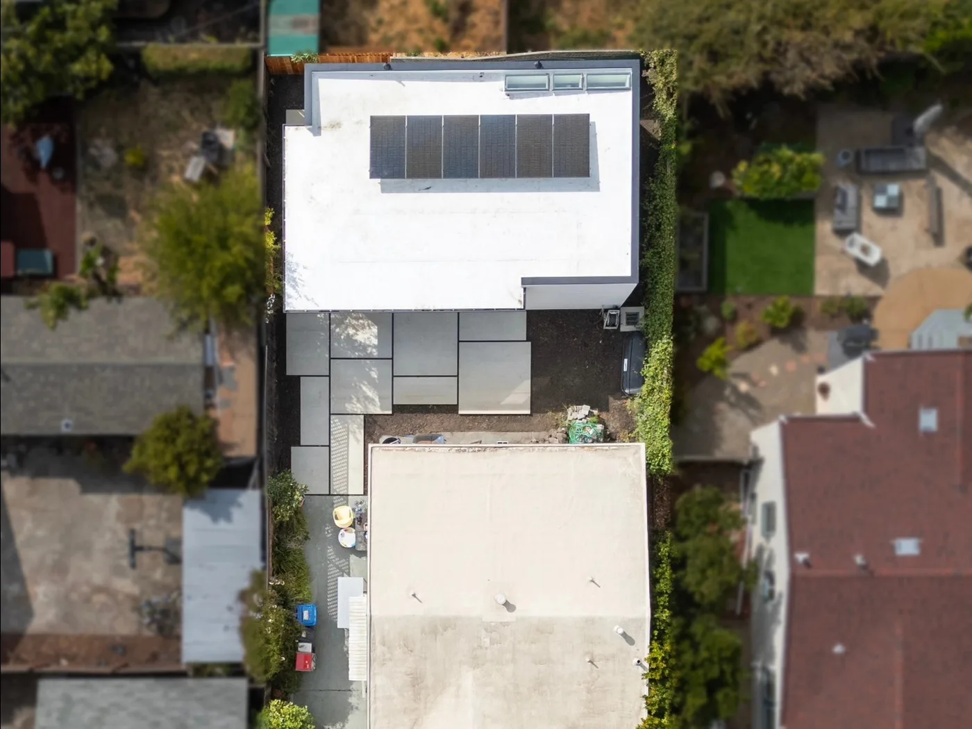 Aerial of the completed property showing the patio wrapping the home — Richmond Outdoor Patio, Richmond, CA